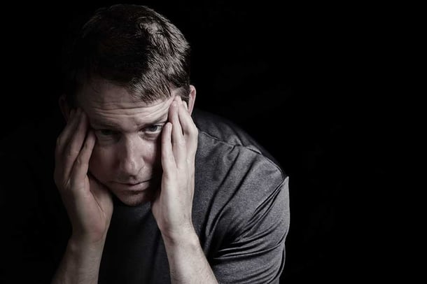 Man Struggling with Alcohol Withdrawal Symptoms
